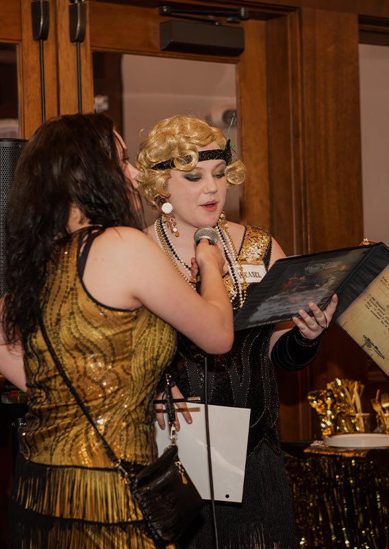 A group of people play in a murder mystery game.